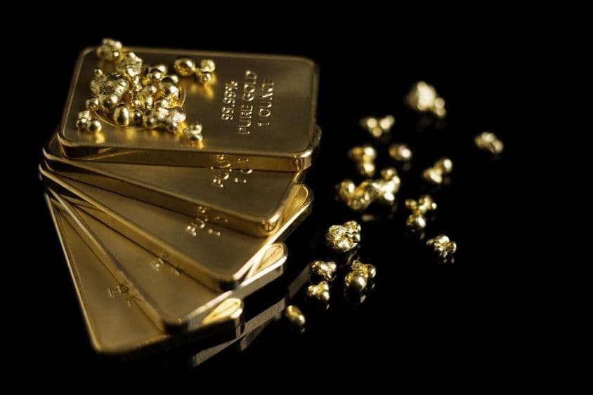 Barras de ouro e algumas migalhas de ouro.