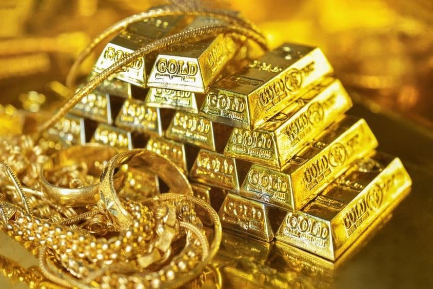 Barras de ouro e joias de ouro